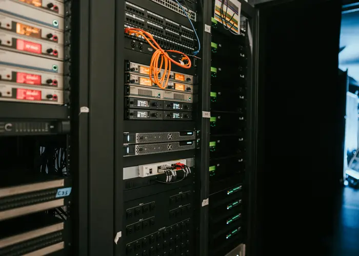 Rack of servers and network equipment in a server room